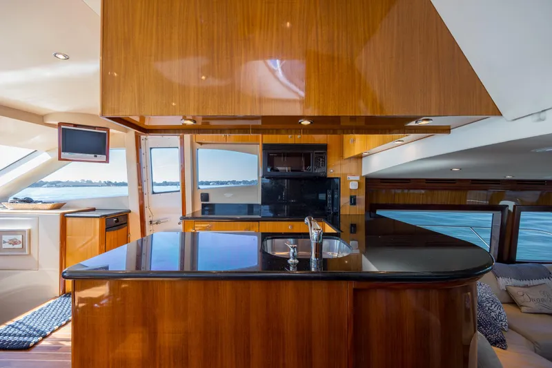Slide: The Image of Luxurious interior of 2007 Hatteras 64 Motor Yacht with sleek wood finishes and modern amenities. - 23