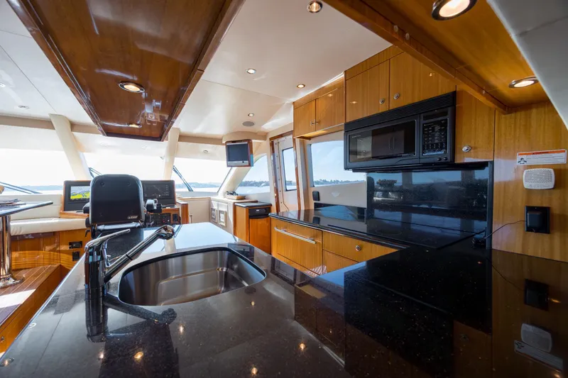 Slide: The Image of Luxurious kitchen interior of 2007 Hatteras 64 Motor Yacht with modern amenities. - 24