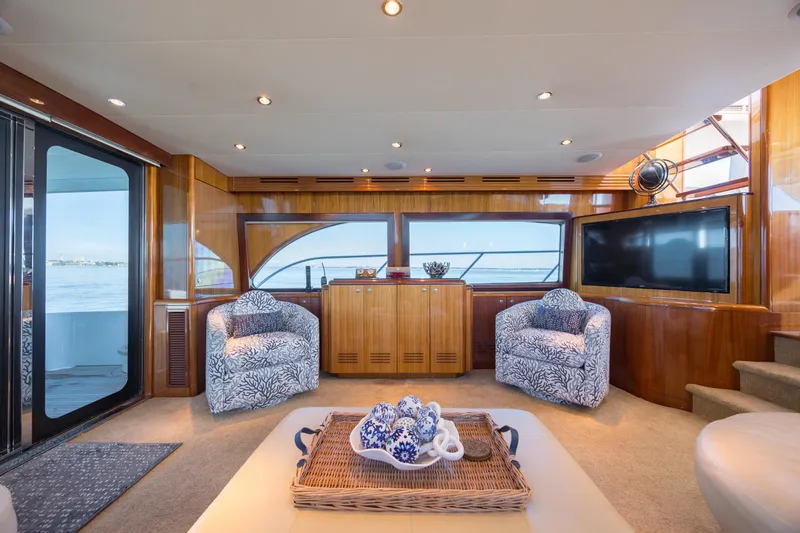 Slide: The Image of Luxurious interior of 2007 Hatteras 64 Motor Yacht with elegant seating and ocean view. - 31