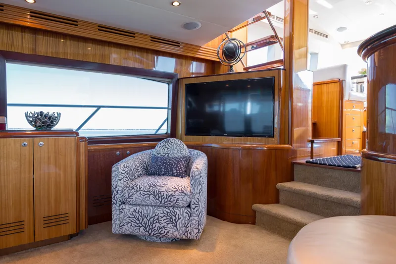 Slide: The Image of Luxurious interior of 2007 Hatteras 64 Motor Yacht with elegant wood finishes and plush seating. - 32