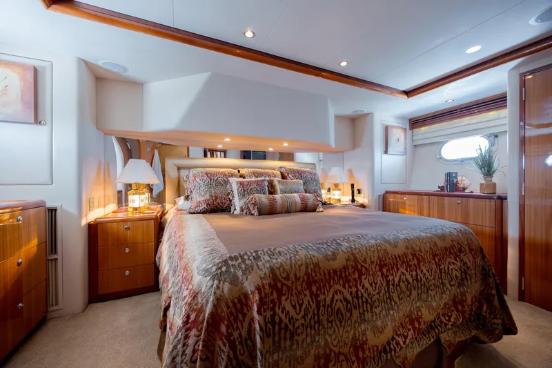 Slide: The Image of Luxurious bedroom interior of 2007 Hatteras 64 Motor Yacht with elegant decor and ambient lighting. - 36