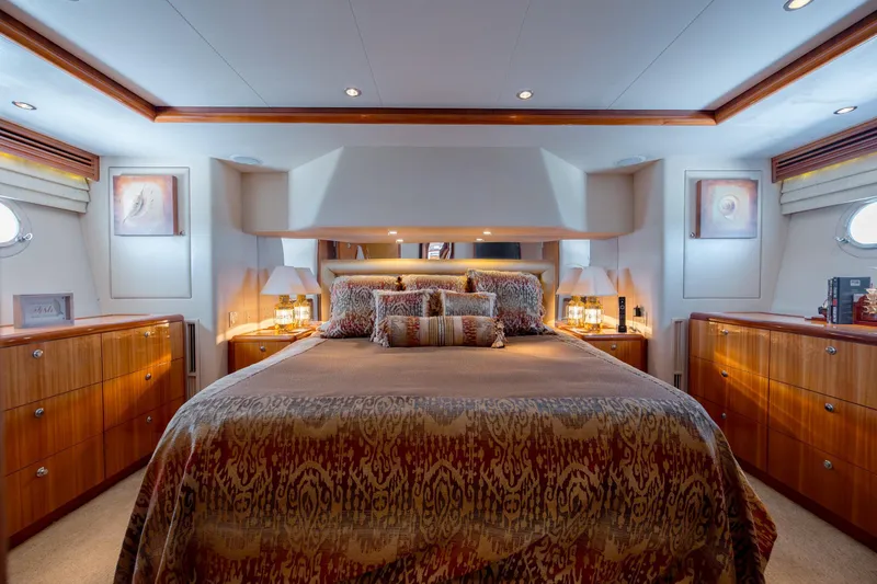 Slide: The Image of Luxurious bedroom interior of 2007 Hatteras 64 Motor Yacht with elegant wood finishes. - 37