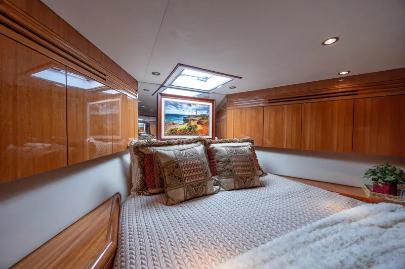 Slide: The Image of Luxurious bedroom interior of 2007 Hatteras 64 Motor Yacht with elegant wood cabinetry. - 39