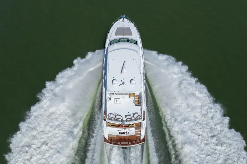 Slide: The Image of Aerial view of 2007 Hatteras 64 Motor Yacht cruising on water. - 4