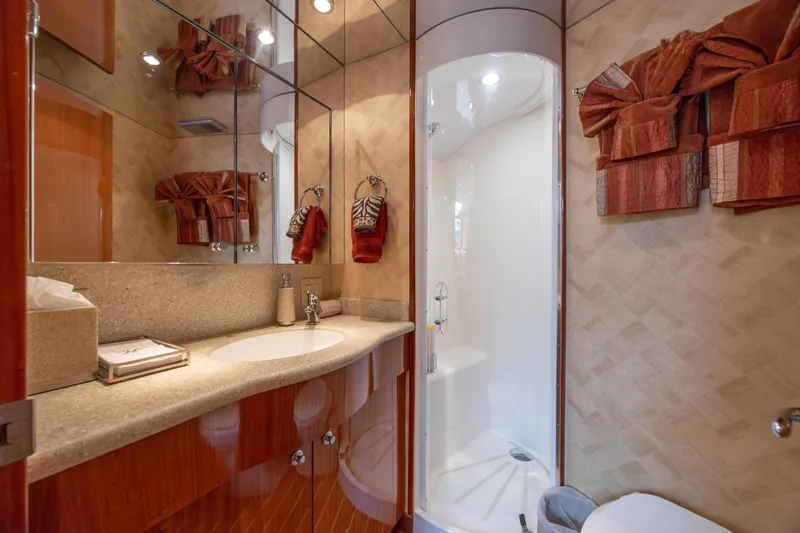 Slide: The Image of Luxurious bathroom in 2007 Hatteras 64 Motor Yacht with elegant fixtures and shower. - 41