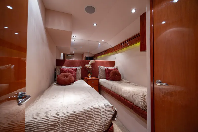 Slide: The Image of Luxurious cabin interior of 2007 Hatteras 64 Motor Yacht with twin beds and elegant decor. - 42