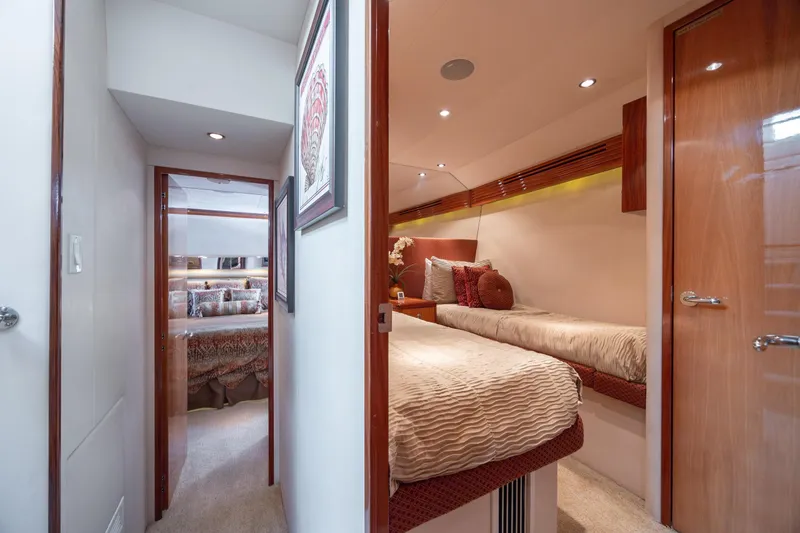 Slide: The Image of Interior of 2007 Hatteras 64 Motor Yacht with cozy twin beds and elegant decor. - 43