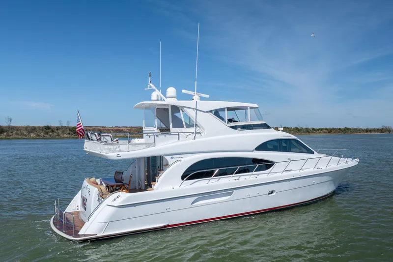 Slide: The Image of 2007 Hatteras 64 Motor Yacht cruising on a sunny day. - 5