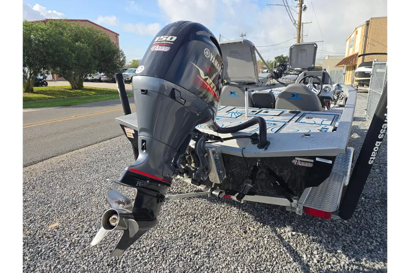 Slide: The Image of 2022 Xpress H18C Crappie boat with Yamaha outboard motor on gravel. - 10