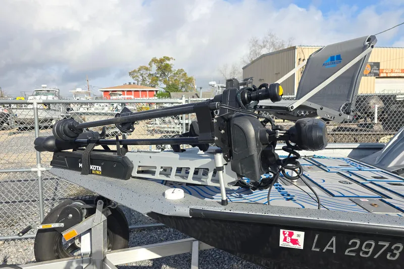 Slide: The Image of 2022 Xpress H18C Crappie boat with Minn Kota Ultrex trolling motor on trailer. - 12