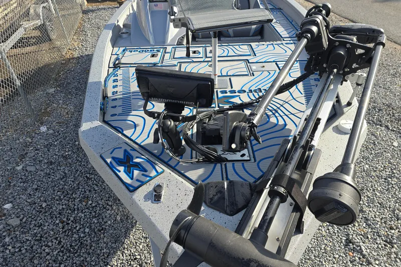 Slide: The Image of 2022 Xpress H18C Crappie boat with advanced fishing equipment on deck. - 13