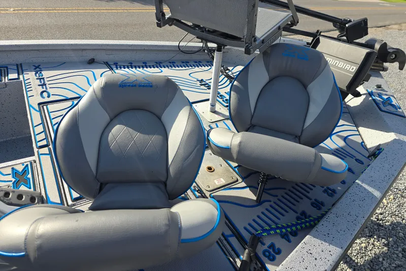Slide: The Image of 2022 Xpress H18C Crappie boat with comfortable seating and detailed deck design. - 18