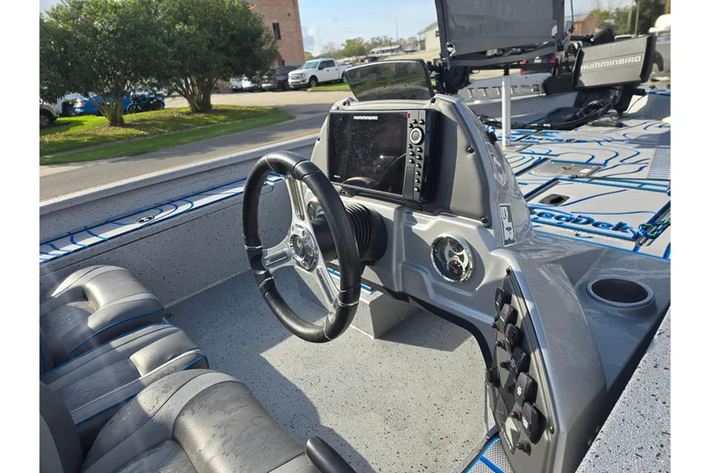 Slide: The Image of 2022 Xpress H18C Crappie boat interior with steering wheel and navigation system. - 7