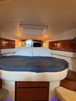 Slide: The Image of Interior of a 2005 Sea Ray 340 Sundancer yacht with cozy bed. - 4