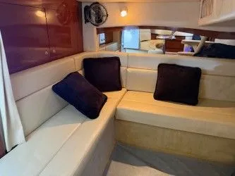 Slide: The Image of Interior of 2005 Sea Ray 340 Sundancer with beige sofa and cushions. - 6