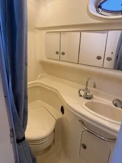 Slide: The Image of Sea Ray 340 Sundancer 2005 bathroom with sink and toilet. - 8