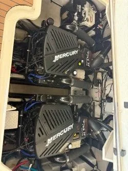 Slide: The Image of Engine compartment of a 2005 Sea Ray 340 Sundancer with Mercury engines. - 9