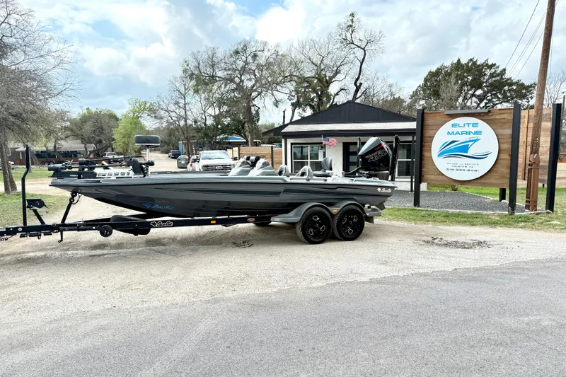 The Image of 2023 Bass Cat Jaguar STS boat on trailer at Elite Marine dealership. - 1