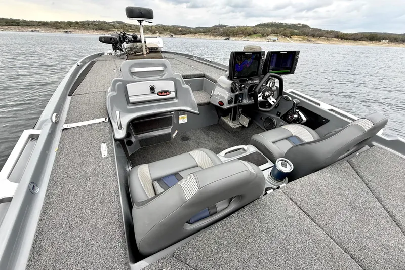 Slide: The Image of 2023 Bass Cat Jaguar STS boat interior with dual seats and advanced navigation system. - 19