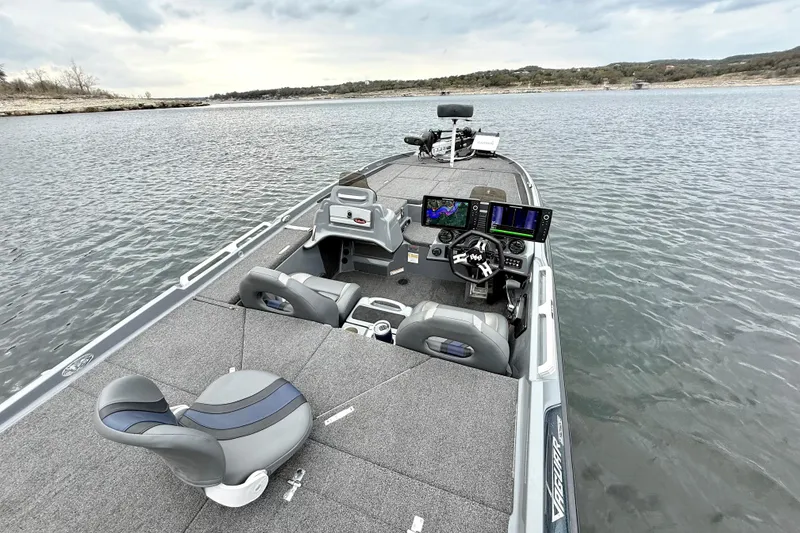 Slide: The Image of 2023 Bass Cat Jaguar STS boat on water, featuring advanced navigation systems and comfortable seating. - 20