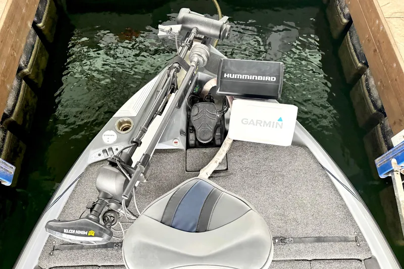 Slide: The Image of 2023 Bass Cat Jaguar STS boat with Garmin and Humminbird electronics. - 27