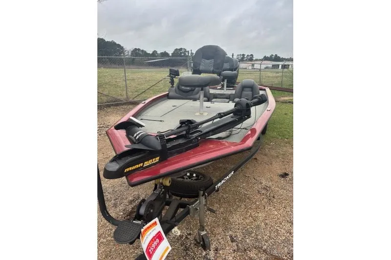 Slide: The Image of 2019 Tracker Pro Team 195 TXW Tournament Edition fishing boat on trailer. - 2