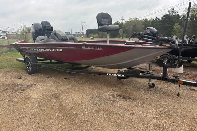 Slide: The Image of 2019 Tracker Pro Team 195 TXW Tournament Edition boat on trailer, parked outdoors. - 3