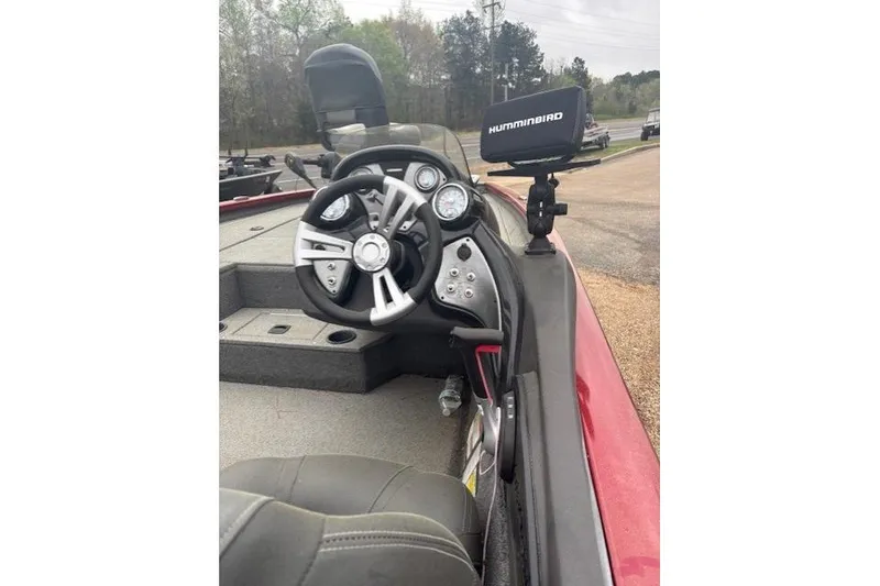 Slide: The Image of 2019 Tracker Pro Team 195 TXW Tournament Edition boat interior with steering wheel and Humminbird device. - 7