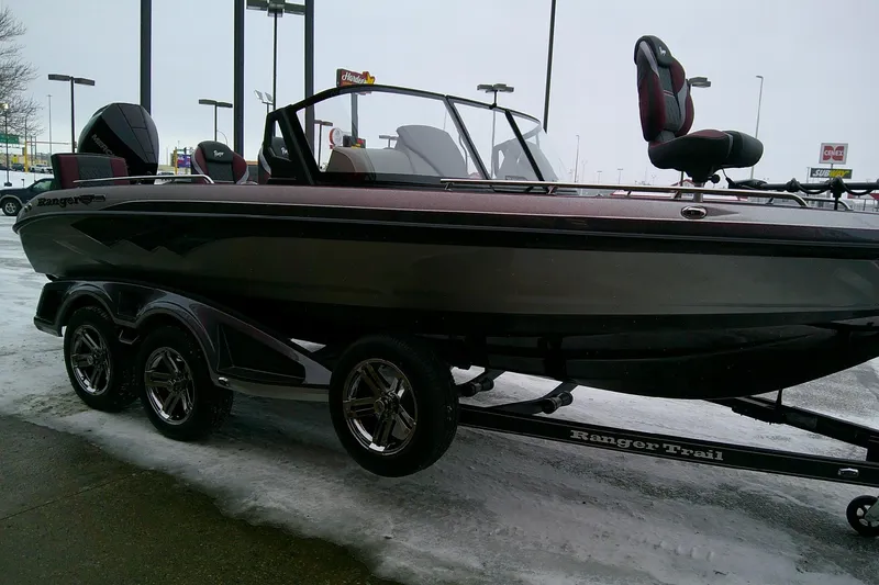 Slide: The Image of 2026 Ranger 620xFS Pro boat on trailer, parked on snowy pavement. - 4