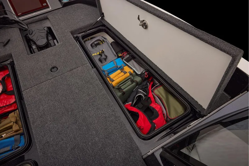Slide: The Image of Manufacturer Provided Image: Storage compartment of 2026 Ranger 620xFS Pro boat, organized with fishing gear and equipment. - 45