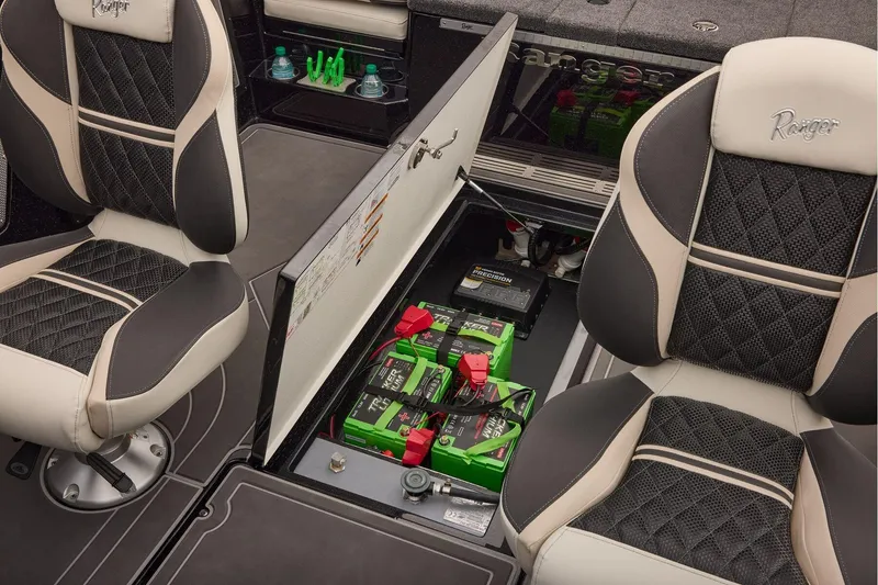 Slide: The Image of Manufacturer Provided Image: 2026 Ranger 620xFS Pro boat interior with battery compartment and stylish seating. - 76