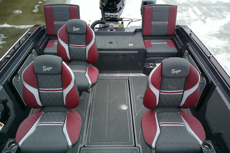 Slide: The Image of 2026 Ranger 620xFS Pro boat interior with red and gray seating, showcasing premium design. - 8