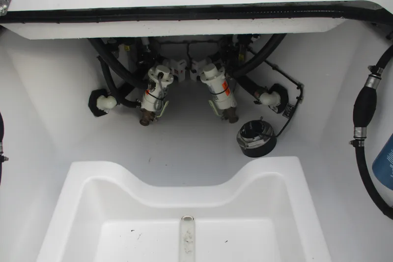Slide: The Image of 2026 Sportsman Open 302 Center Console boat interior, showcasing mechanical components and wiring. - 14