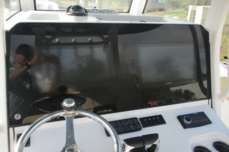 Slide: The Image of 2026 Sportsman Open 302 Center Console dashboard with steering wheel and electronic displays. - 15