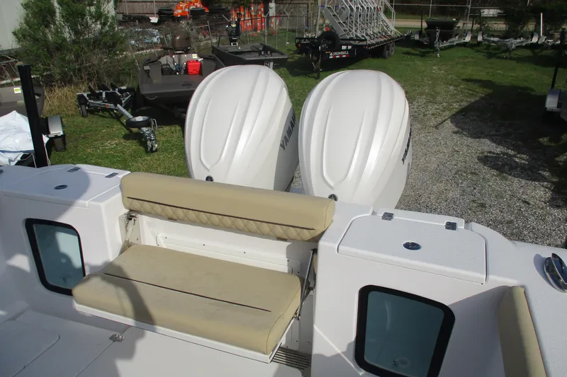 Slide: The Image of 2026 Sportsman Open 302 Center Console with dual engines and beige seating. - 17