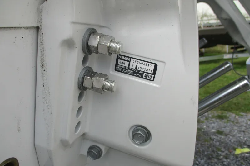 Slide: The Image of Close-up of Yamaha engine mount on 2026 Sportsman Open 302 Center Console boat. - 21