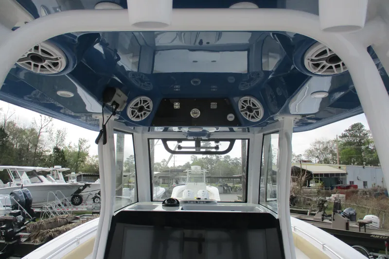 Slide: The Image of 2026 Sportsman Open 302 Center Console boat interior with speakers and control panel. - 5