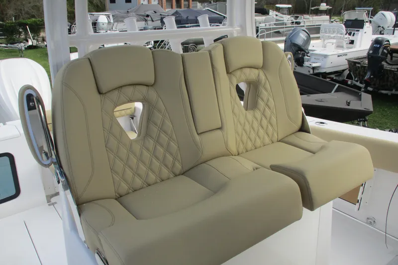 Slide: The Image of Luxurious seating on 2026 Sportsman Open 302 Center Console boat, featuring diamond-stitched upholstery. - 7
