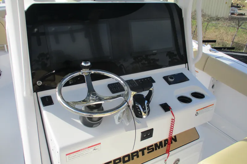 Slide: The Image of 2026 Sportsman Open 302 Center Console helm with steering wheel and controls. - 9