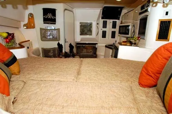 Slide: The Image of Interior of a 2005 Grady-White Express 330 yacht with cozy bed and kitchen. - 9