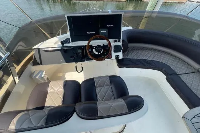 Slide: The Image of 2001 Viking Princess boat helm with dual screens and luxury seating. - 10