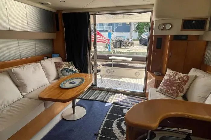 Slide: The Image of Interior of 2001 Viking Princess yacht with cozy seating and elegant decor. - 13