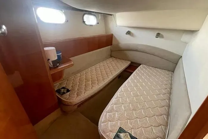 Slide: The Image of 2001 Viking Princess cabin interior with twin beds and wooden accents. - 7