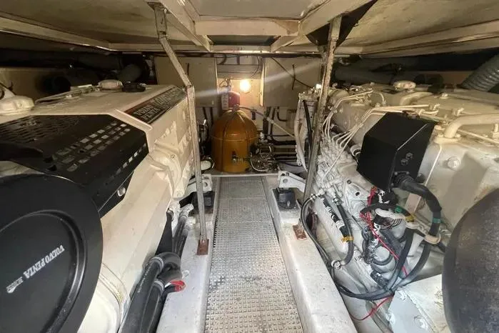 Slide: The Image of Engine room of 2001 Viking Princess yacht, showcasing dual engines and mechanical components. - 8