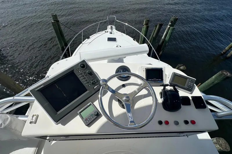Slide: The Image of Cockpit view of 2006 Rampage 33 Express boat with navigation equipment. - 13