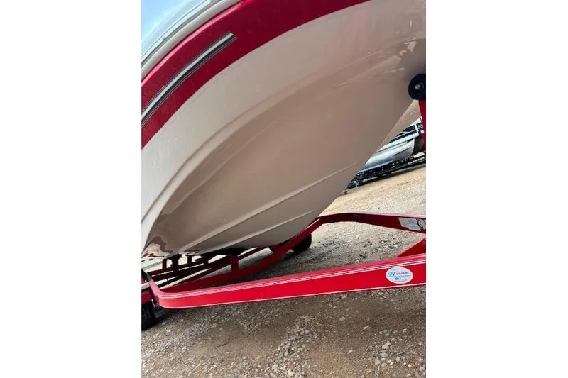 Slide: The Image of 2011 Glastron DS 205 boat on red trailer, viewed from below. - 4