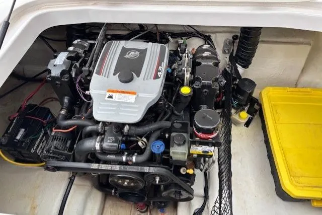 Slide: The Image of 2011 Glastron DS 205 boat engine compartment with visible components and wiring. - 7