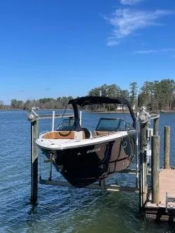 The Image of Chaparral 287 SSX 2022 on boat lift by the lake. - 0