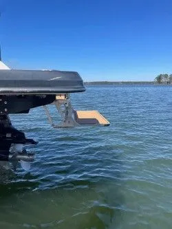 Slide: The Image of 2022 Chaparral 287 SSX with fold-out swim platform on calm water. - 11