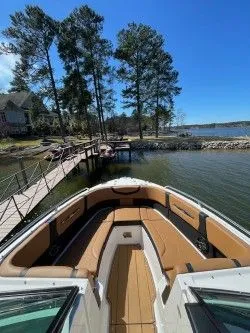 Slide: The Image of Chaparral 287 SSX 2022 at lakeside with dock and trees. - 2